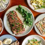 a bunch of plates of food on a table.