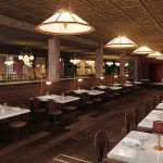 a restaurant with tables, chairs, and lamps.
