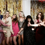 a group of women standing next to each other.