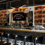 a bar with lots of bottles of alcohol.