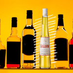 a row of bottles of wine sitting on top of a shelf.