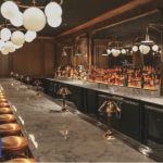 a bar with a bunch of bottles on it.