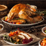 a table full of thanksgiving food including turkey, cranberry sauce, green beans.