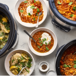 a table topped with bowls of different types of food.