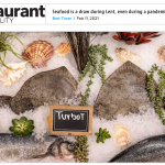 an image of a seafood display with a sign.