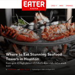 a plate of food with lobsters on it.