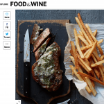 a steak and french fries on a cutting board.