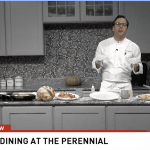 a man standing in a kitchen preparing food.