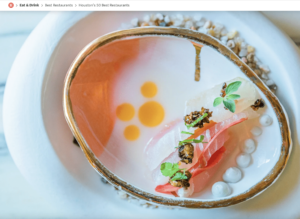 a white plate topped with food on top of a table.