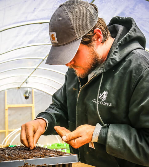 Farmer planting seeds