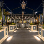 a night time view of an outdoor restaurant.