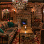 a living room filled with furniture and a fire place.