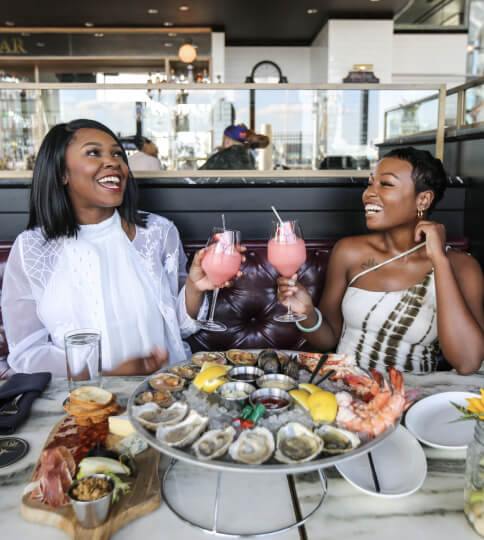 Friends cheers their cocktails