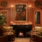 a living room filled with furniture and a fire place.