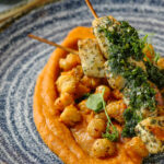 a plate of food on a blue and white plate.