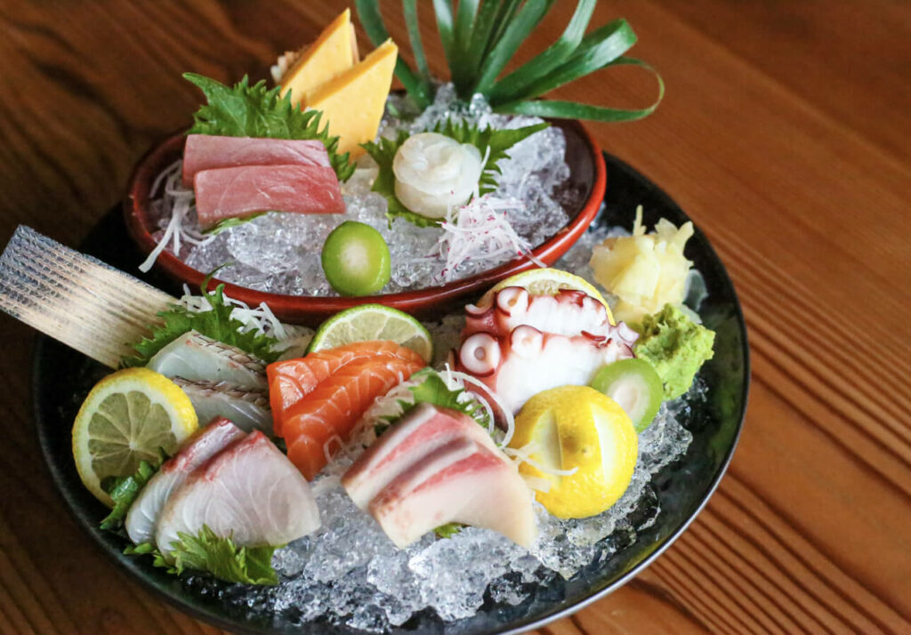 a couple of bowls filled with different types of food.