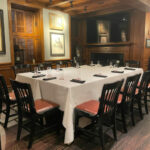 a long table with a white table cloth on it.