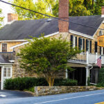 a small building with a sign on the front of it.