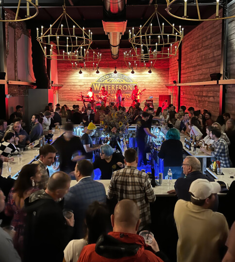 a large group of people sitting around a table.