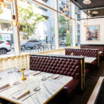 A restaurant with tables and chairs.