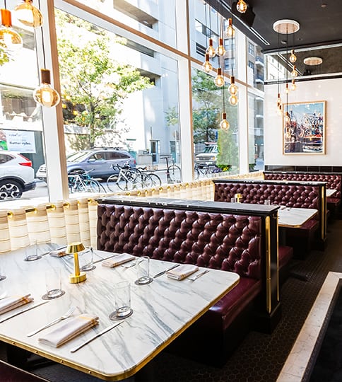 A restaurant with tables and chairs.